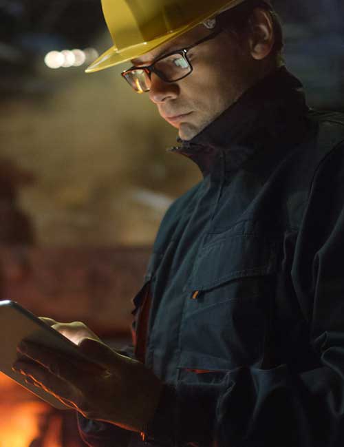 Engineer in Glasses using Tablet PC in Foundry